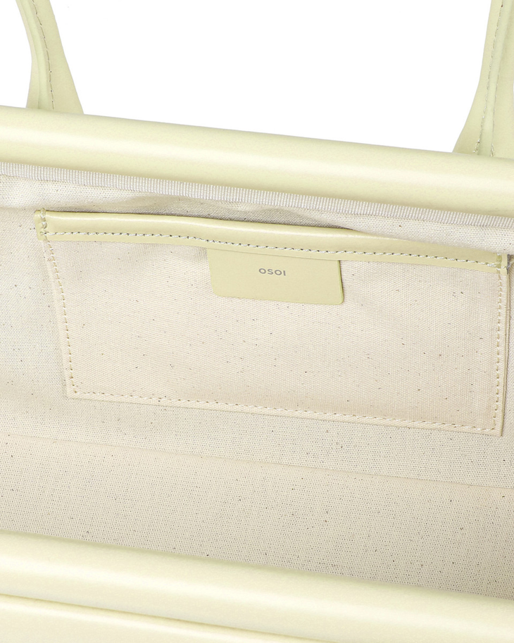 Cream wide boat bag with structured silhouette and silver hardware detail — Osoi | Endless UAE