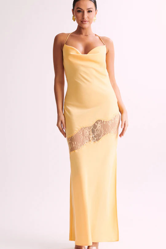 Woman wearing yellow Chandra Lace Dress with cowl neckline and lace side cutout — Meshki | Endless UAE