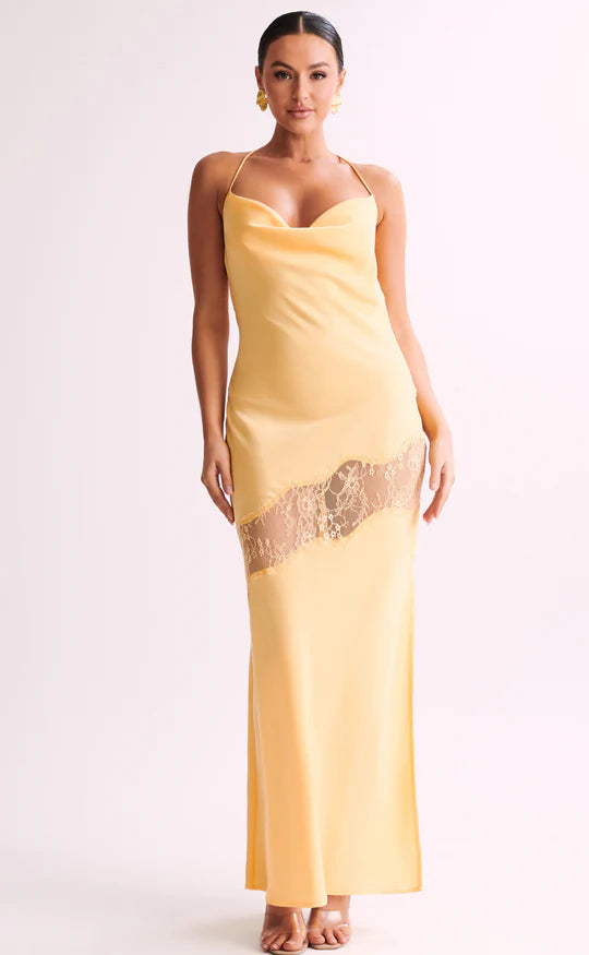 Woman wearing yellow Chandra Lace Dress with cowl neckline and lace side cutout — Meshki | Endless UAE