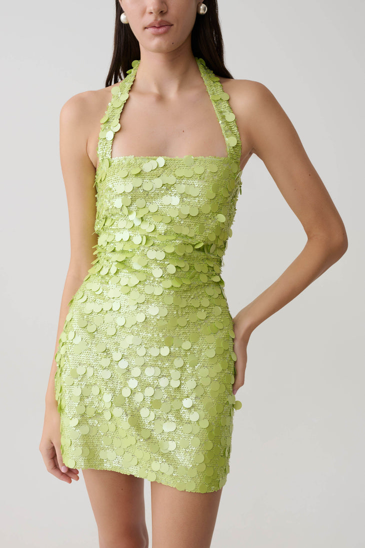 Woman wearing lime green sequin halter mini dress with scalloped neckline — Meshki | Endless UAE