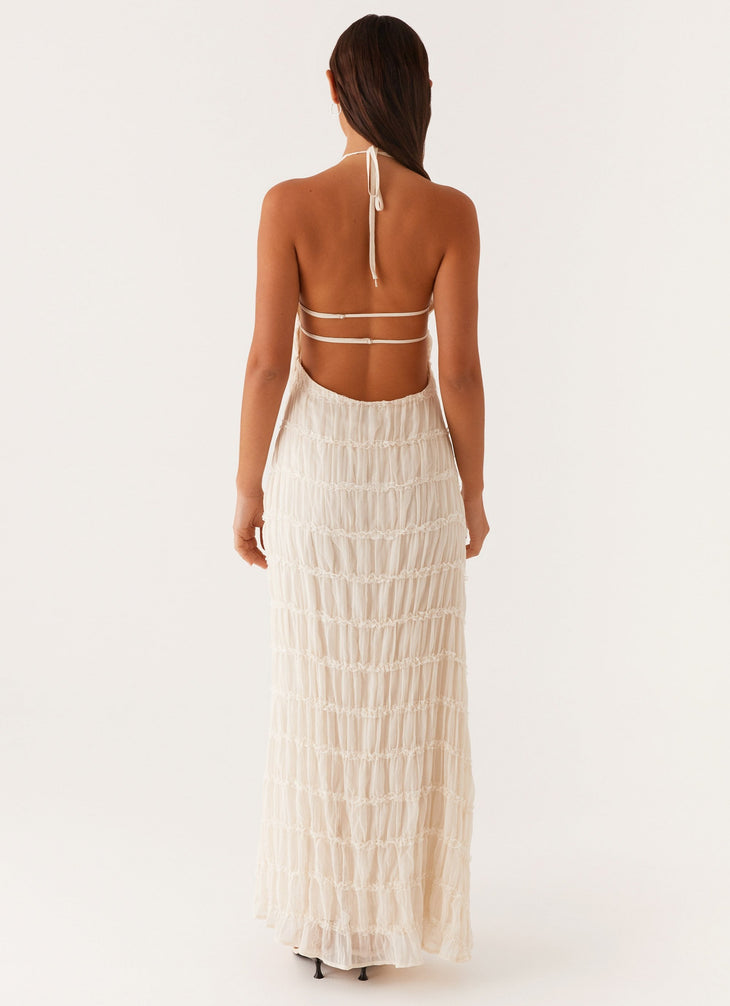 Woman wearing white pleated halter maxi dress in modern interior space — Peppermayo | Endless UAE