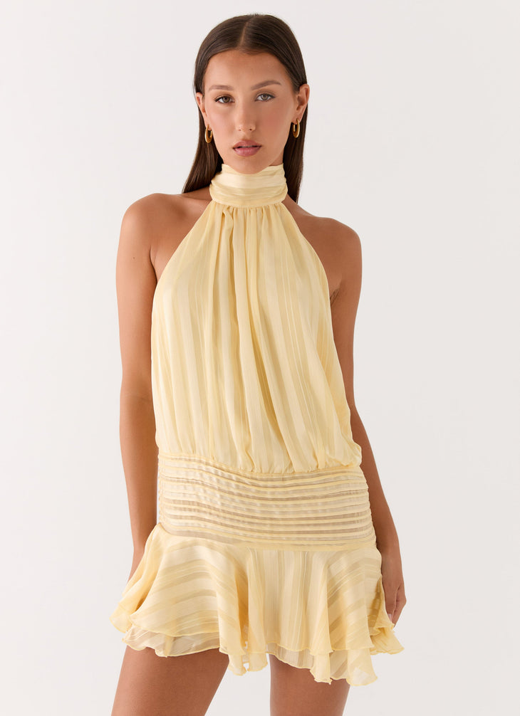 Pale yellow pleated halter chiffon mini dress with ruched waist detail — Peppermayo | Endless UAE
