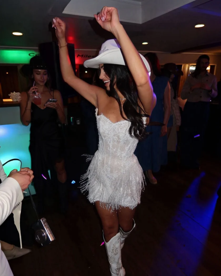 The Monaco Mini white beaded fringe dress on woman at formal event — Kiyoko Handmade | Endless UAE
