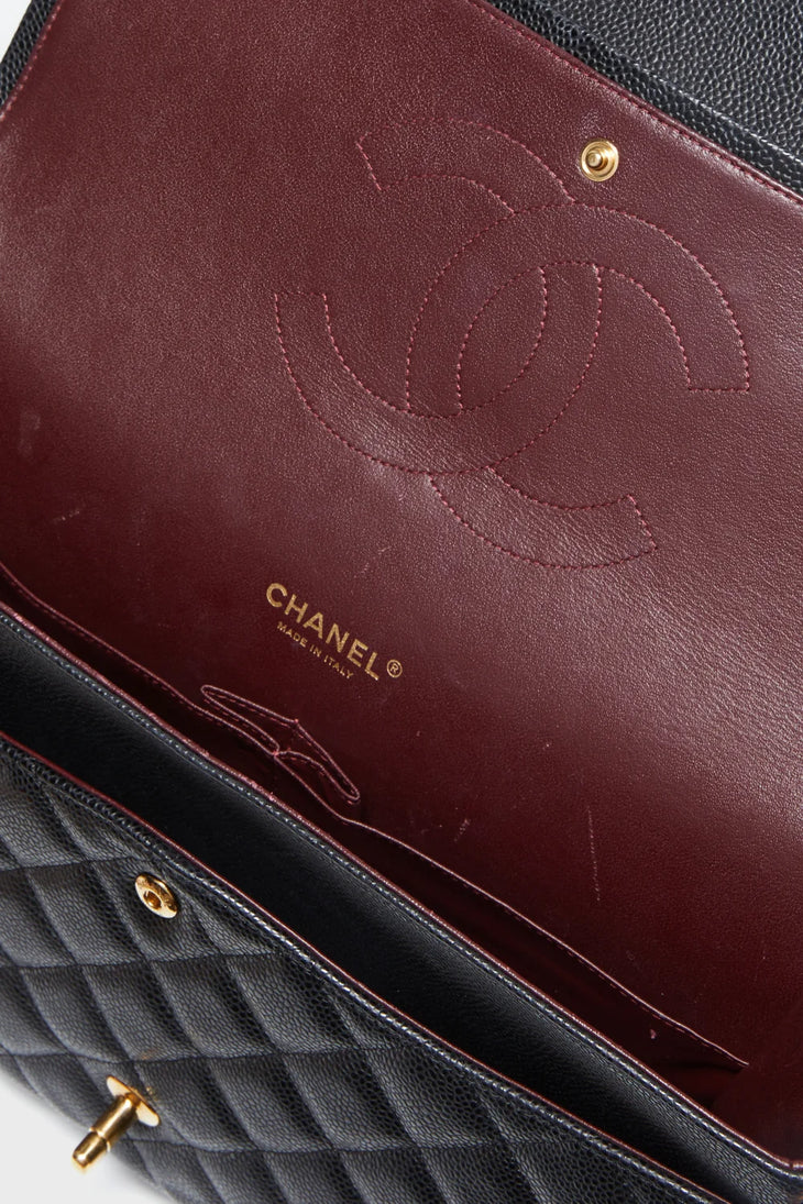 Black quilted leather maxi double flap shoulder bag with gold chain strap — Chanel | Endless UAE