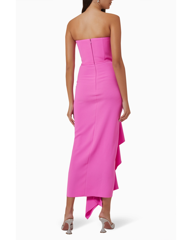 Woman wearing hot pink strapless draped midi dress with asymmetrical ruffle detail — Solace London | Endless UAE