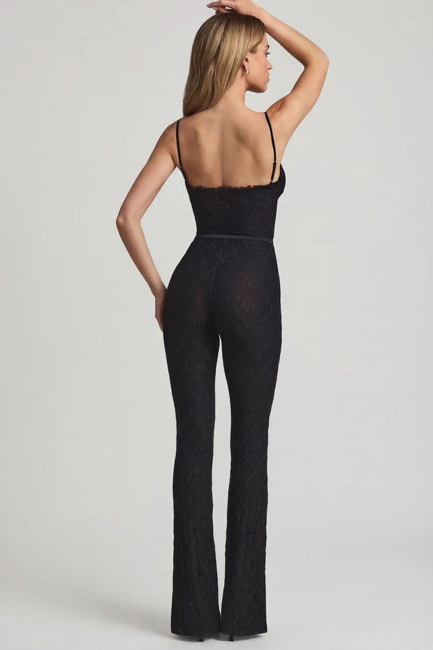 Black textured flared jumpsuit with ruched bustier top and thin straps — Oh Polly | Endless UAE