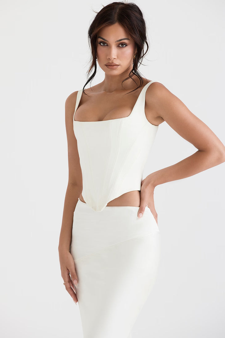 Woman wearing white satin longline corset with cutout sides and square neckline — House of CB | Endless UAE