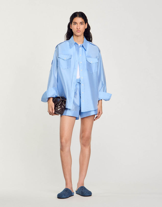 Light blue oversized shirt with chest pockets worn open — Sandro | Endless UAE