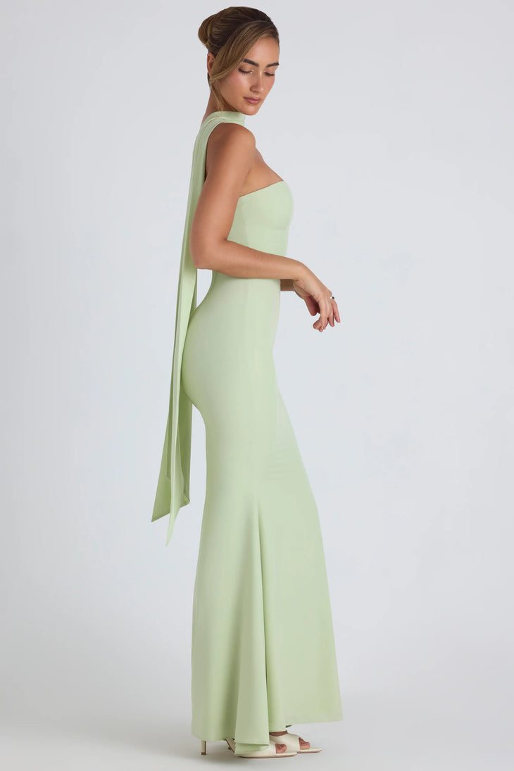 Woman wearing pale green strapless gown with flowing scarf detail — Oh Polly | Endless UAE