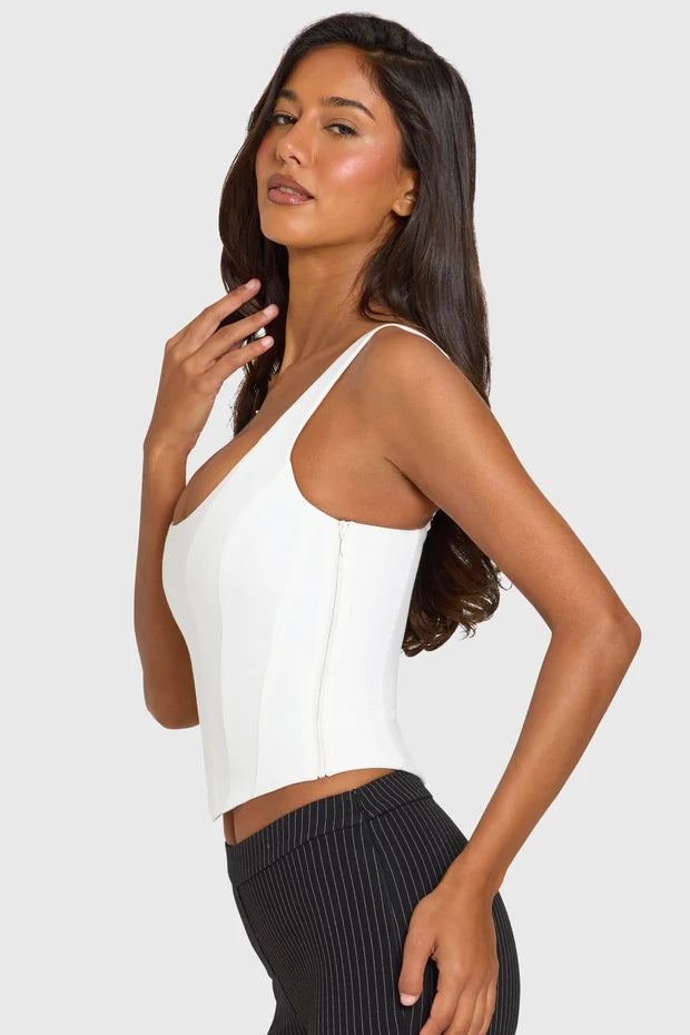 White sleeveless scoop neck corset top paired with black ribbed capri leggings — Oh Polly | Endless UAE