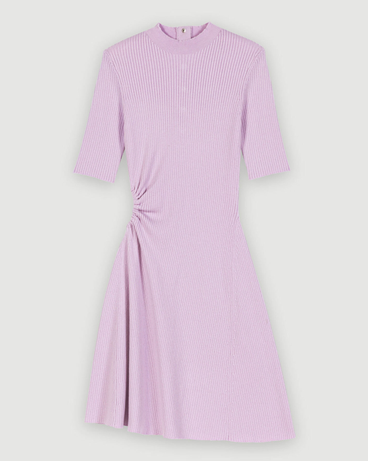 Woman wearing lavender ribbed midi dress with black socks and platform sandals holding colorful woven bag — Maje | Endless UAE