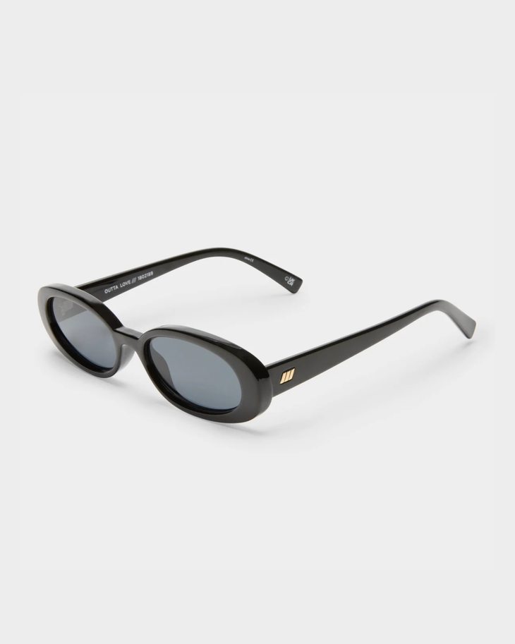 Black oval sunglasses with smoke-tinted lenses and thick frames — Le specs | Endless UAE