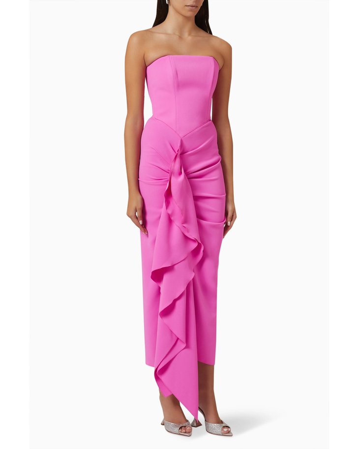 Woman wearing hot pink strapless draped midi dress with asymmetrical ruffle detail — Solace London | Endless UAE