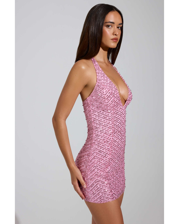 Woman wearing pink sequined halterneck mini dress with deep V-neckline — Oh Polly | Endless UAE
