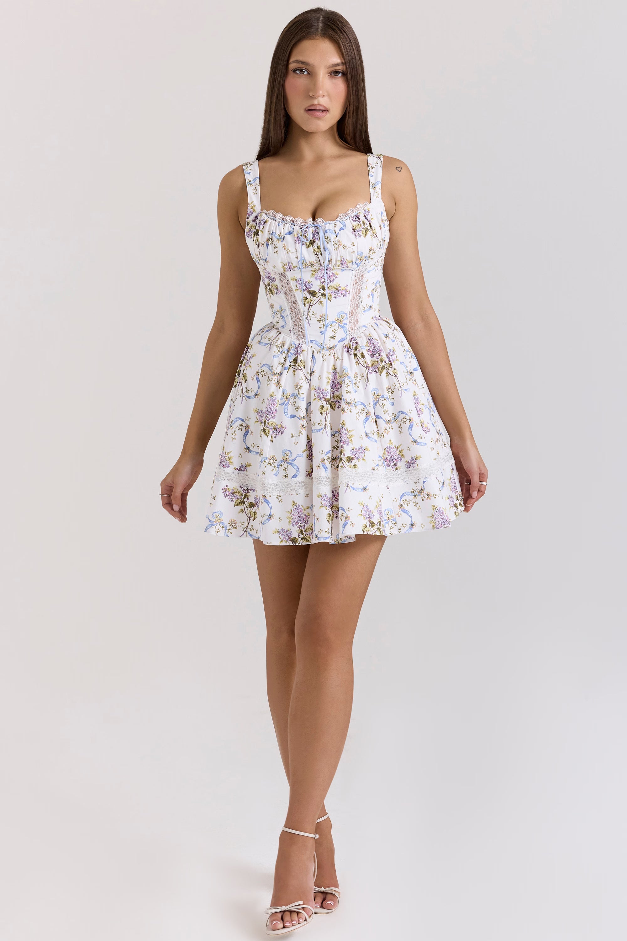Woman wearing white floral ribbon print cotton mini dress with sweetheart neckline and full skirt — House of CB | Endless UAE
