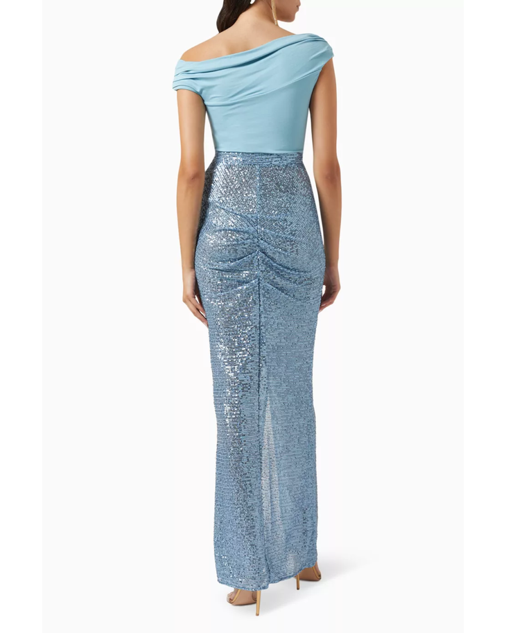 Woman wearing light blue off-shoulder top with sequined blue maxi skirt — Elisabetta Franchi | Endless UAE