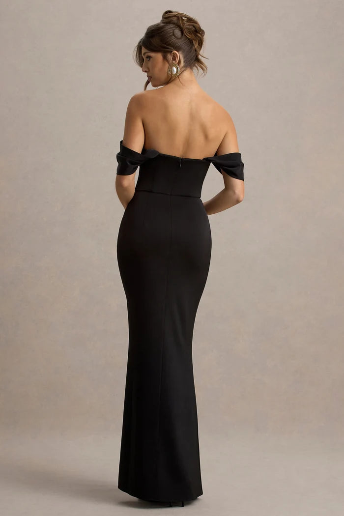 Woman wearing black satin off-shoulder maxi dress with high slit — Club L London | Endless UAE