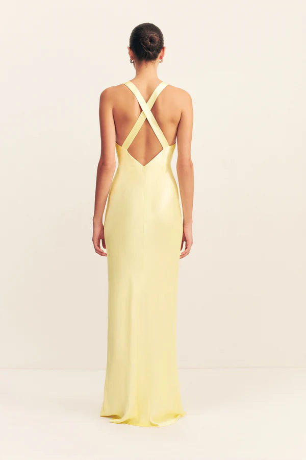 Woman wearing yellow sleeveless plunged neckline maxi dress with cross back detail — Shona Joy | Endless UAE