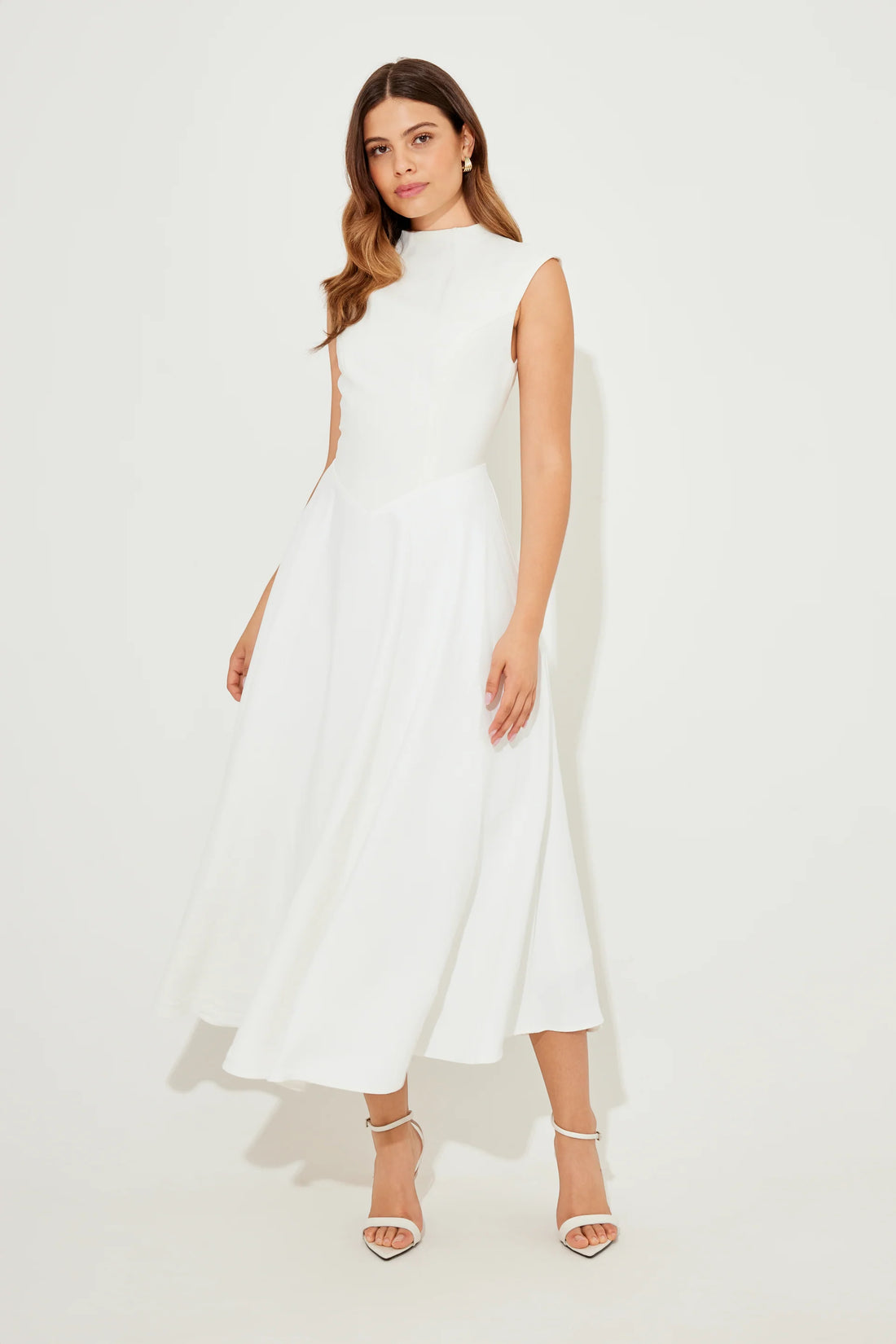 Woman wearing white sleeveless high waist midi dress with pleated skirt — Odd Muse | Endless UAE