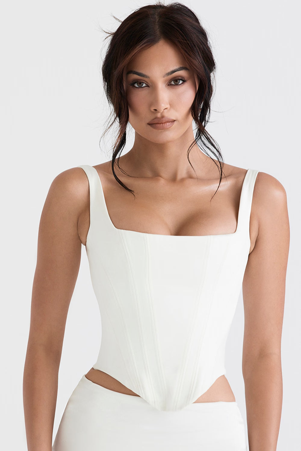 Woman wearing white satin longline corset with cutout sides and square neckline — House of CB | Endless UAE