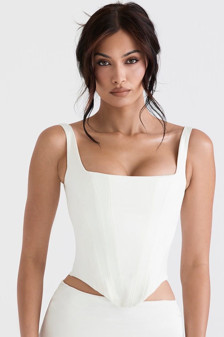 Woman wearing white satin longline corset with cutout sides and square neckline — House of CB | Endless UAE