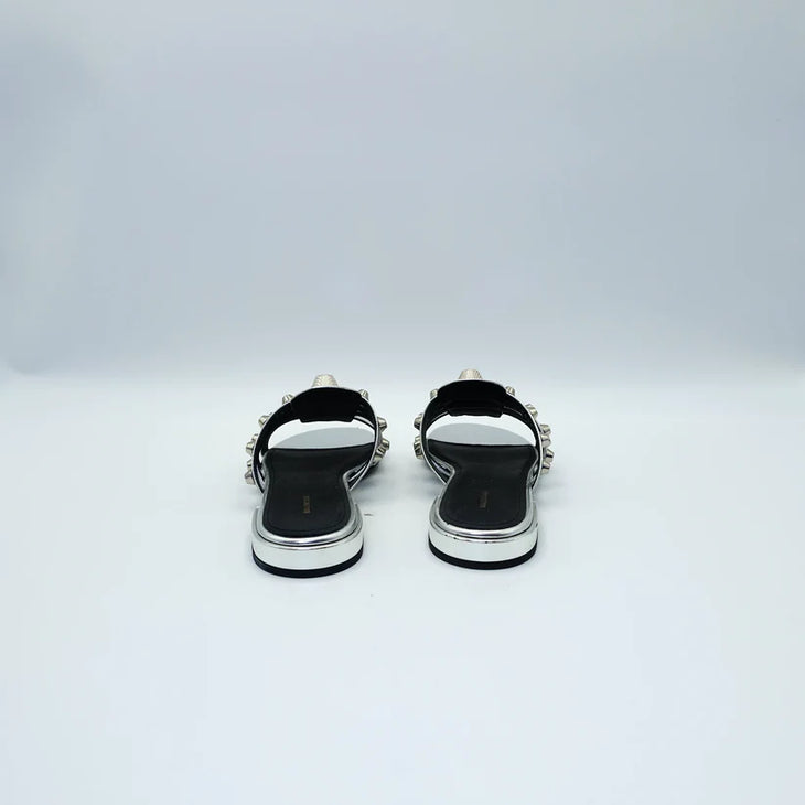 Silver studded flat sandals with black straps and metallic accents — Balenciaga | Endless UAE