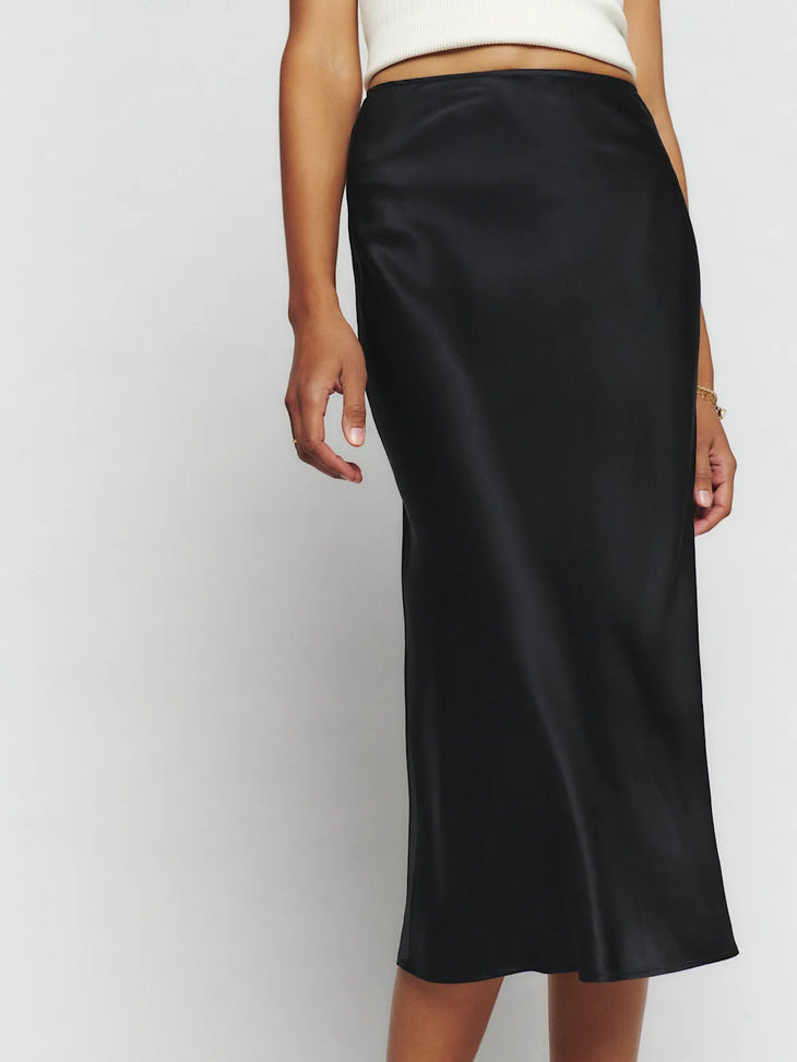 Black silk midi skirt with white crop tank top and black platform sandals — Reformation | Endless UAE