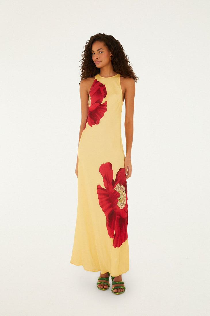 Woman wearing yellow sleeveless maxi dress with red poppy flower print — Farm Rio | Endless UAE