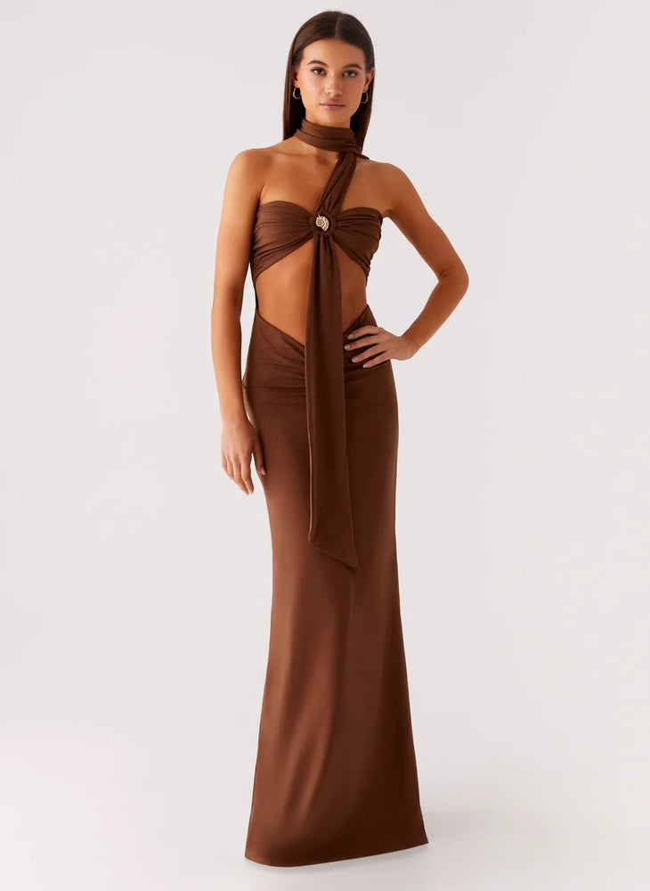 Woman wearing brown halter maxi dress with open back cutout detail — Peppermayo | Endless UAE