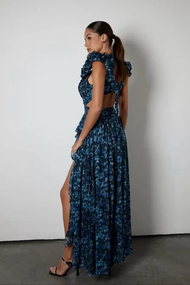 Woman wearing blue patterned Midnight Cassini dress with ruffled shoulders — Anne Louise Boutique | Endless UAE