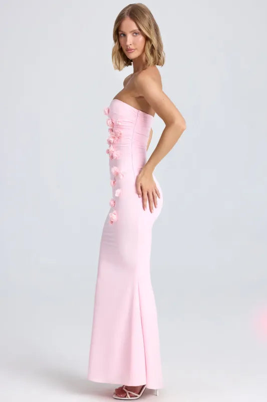 Woman wearing pink strapless maxi dress with floral appliqué details — Oh Polly | Endless UAE
