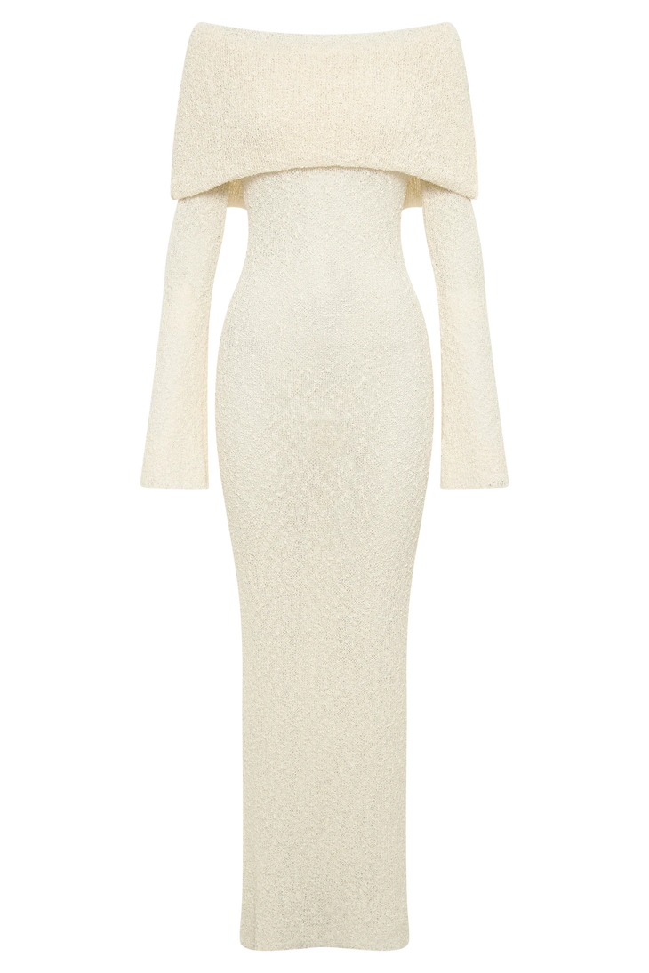 Woman wearing cream off-shoulder boucle maxi dress with draped sleeves and gold woven handbag — Meshki | Endless UAE