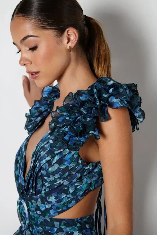 Woman wearing blue patterned Midnight Cassini dress with ruffled shoulders — Anne Louise Boutique | Endless UAE