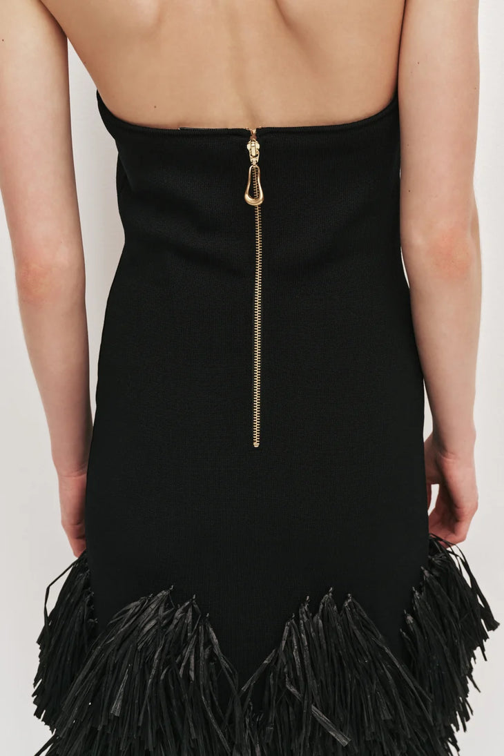 Black halter neck knit dress with tiered raffia fringe skirt — Aje | Endless UAE