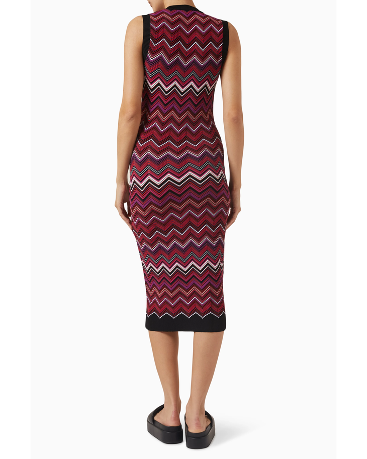 Woman wearing burgundy sequin zigzag midi dress with black trim and platform slides — Missoni | Endless UAE