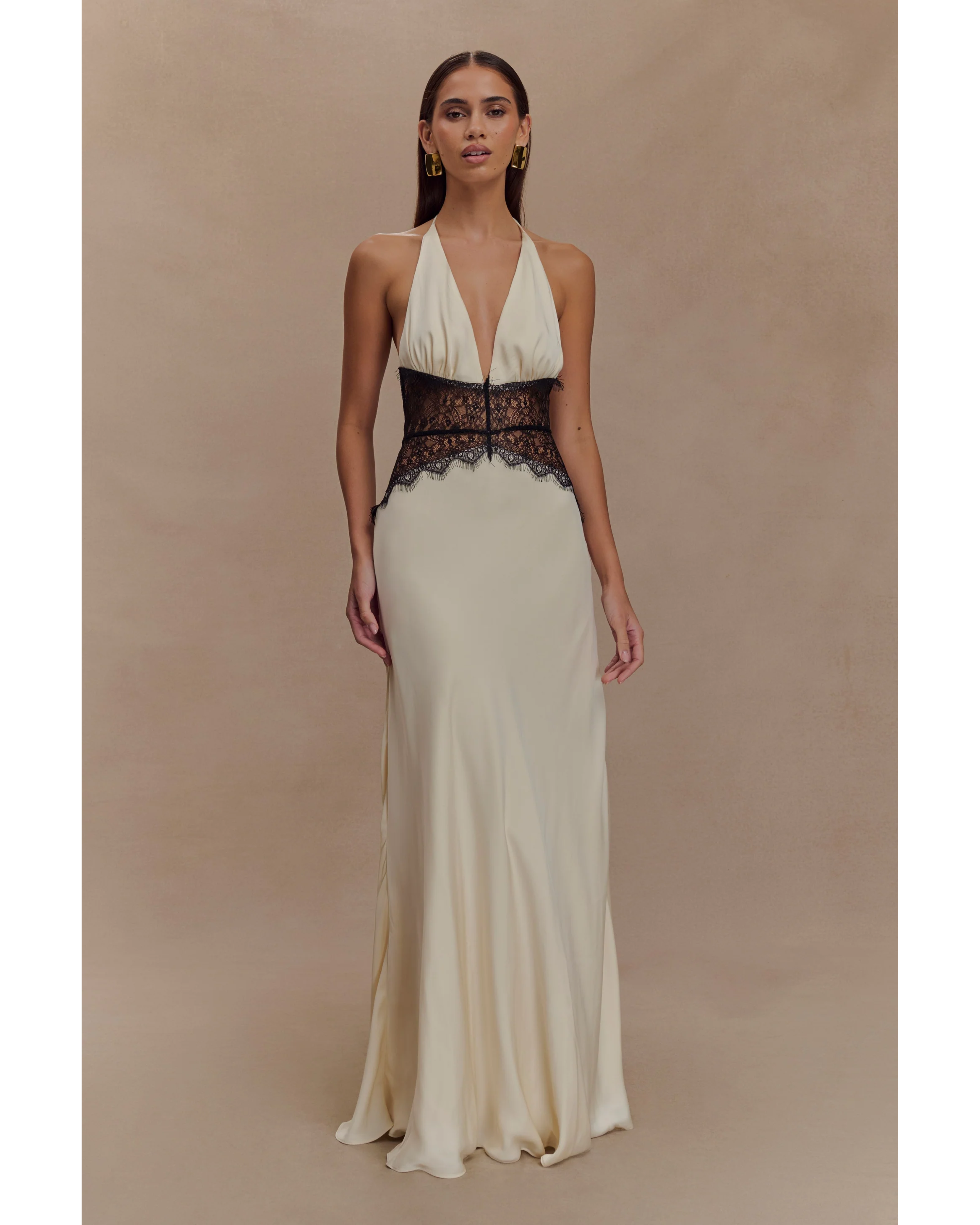 Cream halter neck gown with black lace waist detail and flowing satin skirt — Meshki | Endless UAE