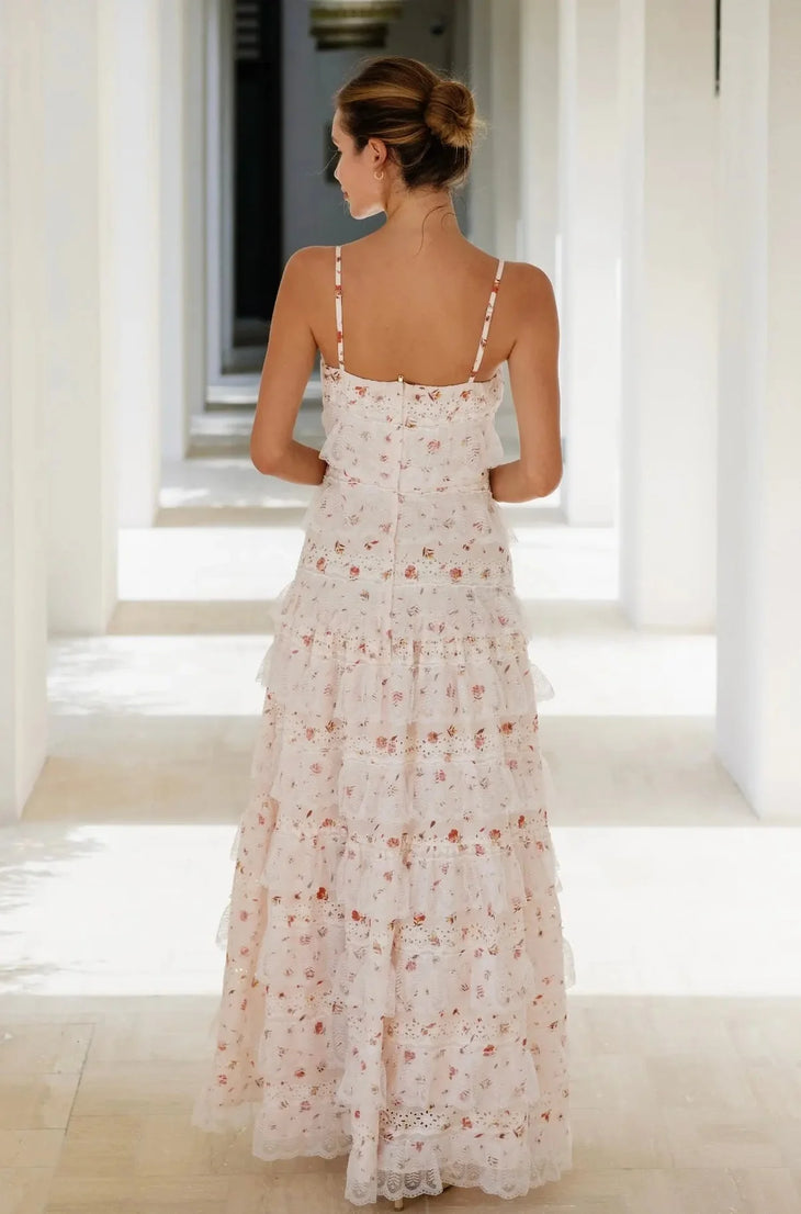Woman wearing blush floral maxi dress with tiered lace skirt and adjustable straps — Anne Louise Boutique | Endless UAE