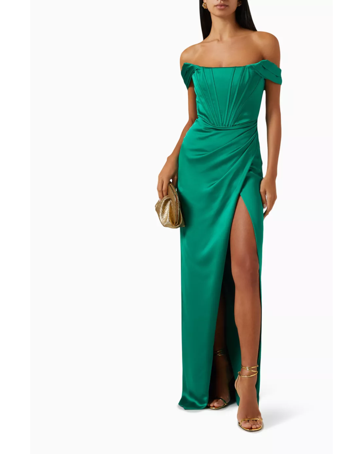 Woman wearing emerald green off-shoulder gown with draped details and high slit — Tarik Ediz | Endless UAE