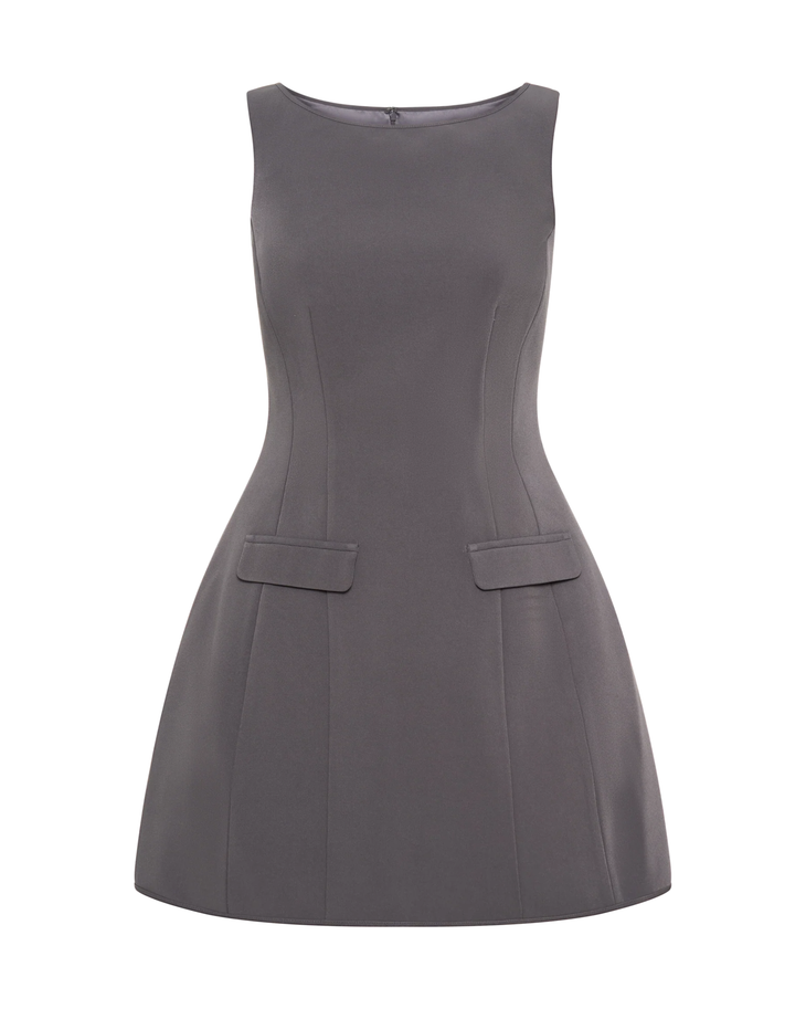 Woman wearing charcoal sleeveless suiting mini dress with front pockets and black platform heels — Meshki | Endless UAE