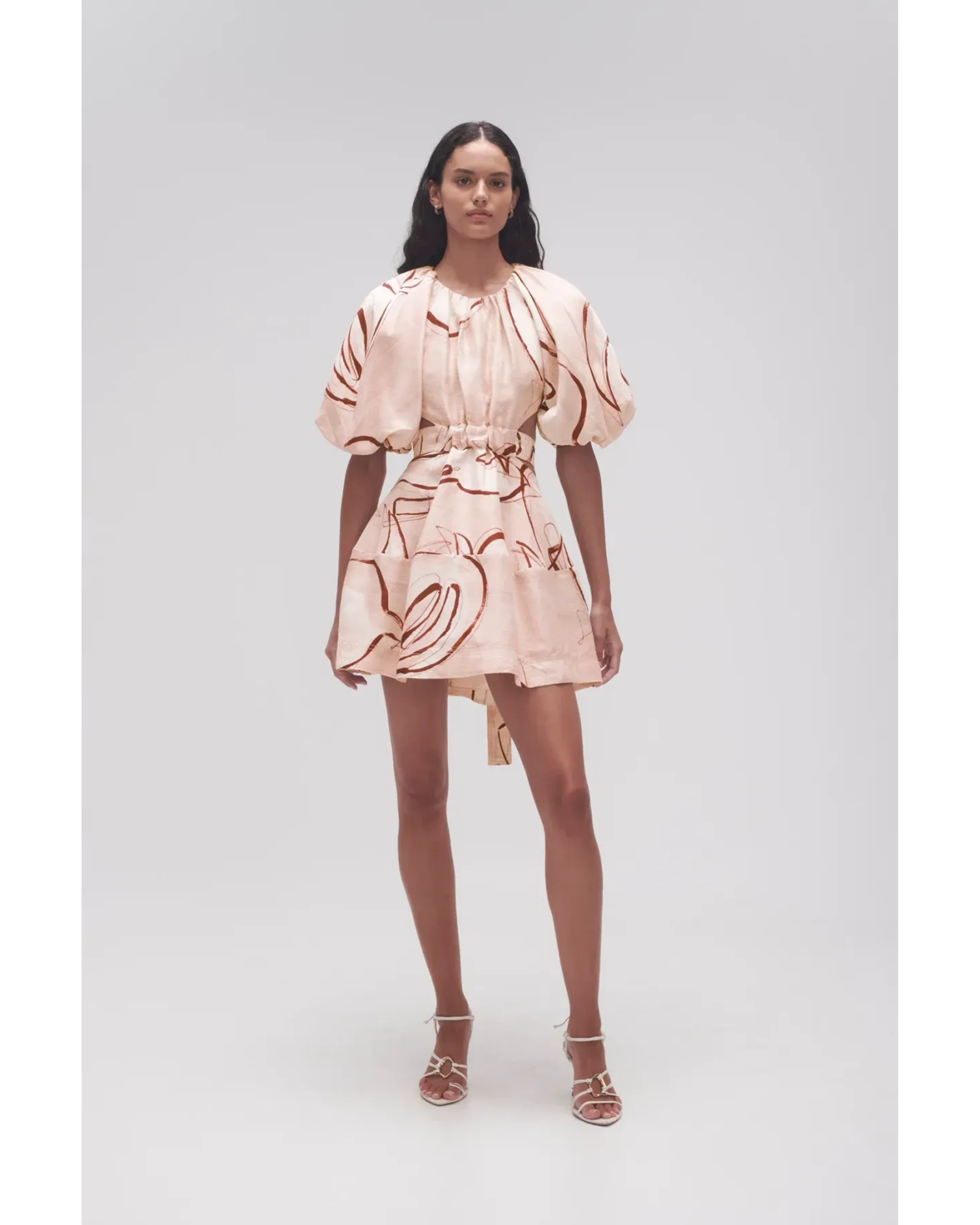 Psychedelia Cut Out Mini Dress in cream with abstract print and puff sleeves — Aje | Endless UAE