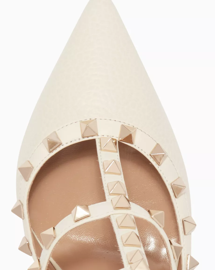 Cream leather pointed-toe pump with signature pyramid stud straps — Valentino Garavani | Endless UAE