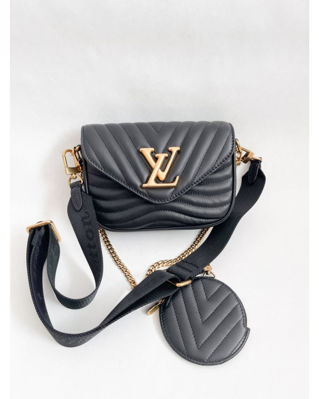 Black quilted LV New Wave Multi Pochette with gold hardware and adjustable strap — Louis Vuitton | Endless UAE