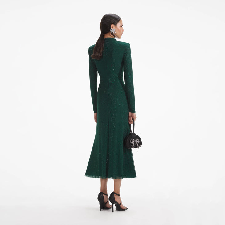 Woman wearing a forest green rhinestone mesh midi dress with long sleeves — Self-portrait | Endless UAE