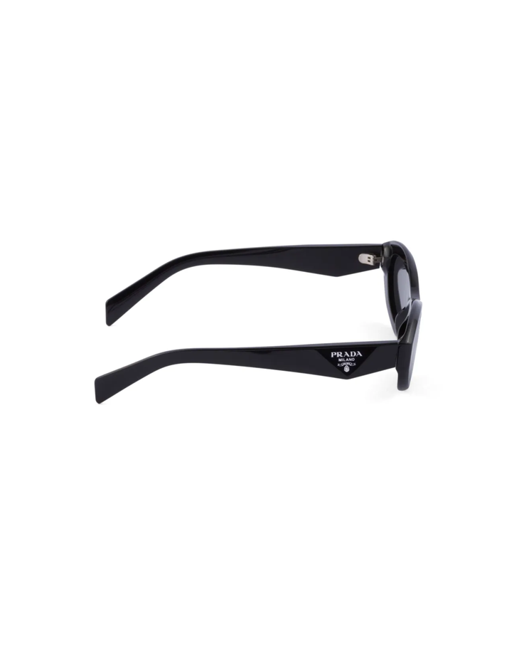 Black oval-frame sunglasses with dark lenses and curved arms — Prada | Endless UAE