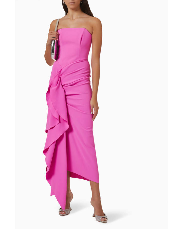 Woman wearing hot pink strapless draped midi dress with asymmetrical ruffle detail — Solace London | Endless UAE
