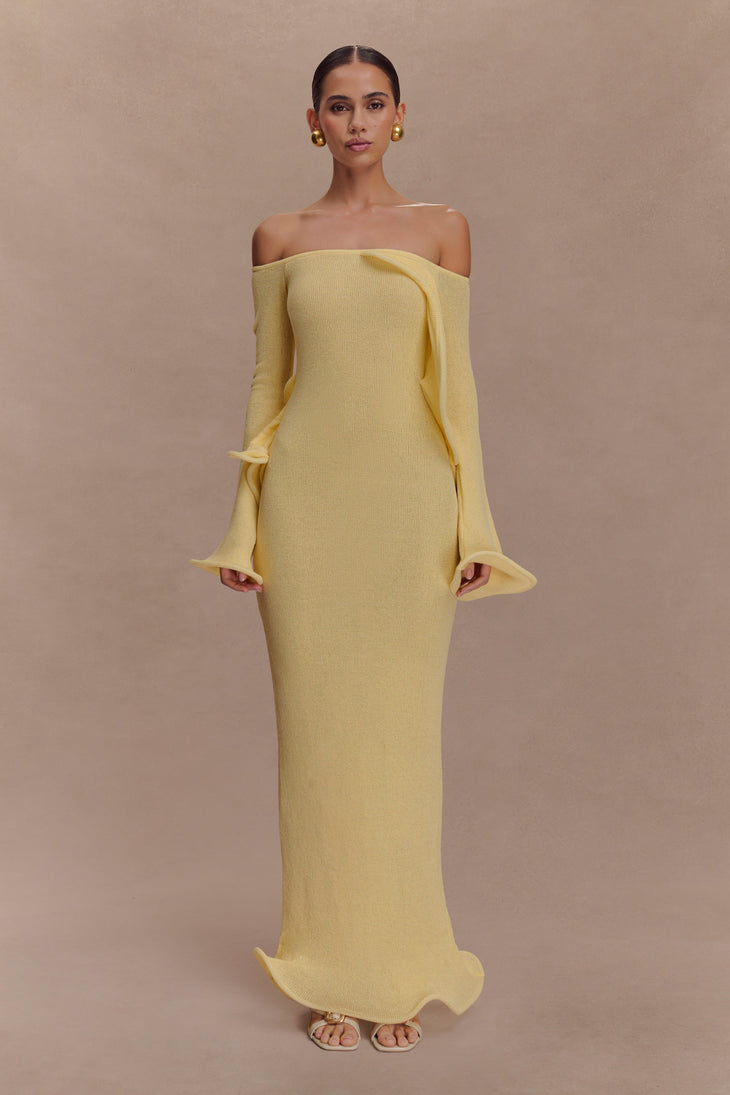 Woman wearing yellow off-shoulder ribbed knit maxi dress with ruffled details — Meshki | Endless UAE