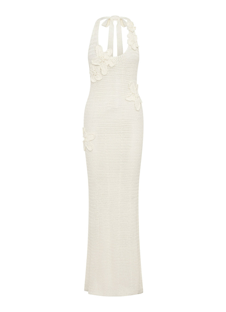 Woman wearing cream crochet halter maxi dress with floral appliqués — Peppermayo | Endless UAE