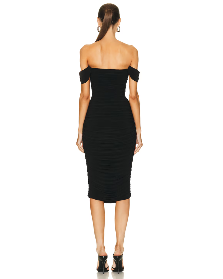 Woman wearing black off-shoulder ruched midi dress with bow details — Norma Kamali | Endless UAE