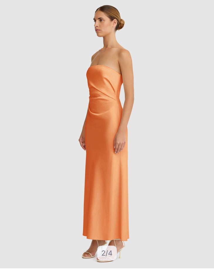 Woman wearing orange strapless maxi dress with ruching detail — Significant Other | Endless UAE