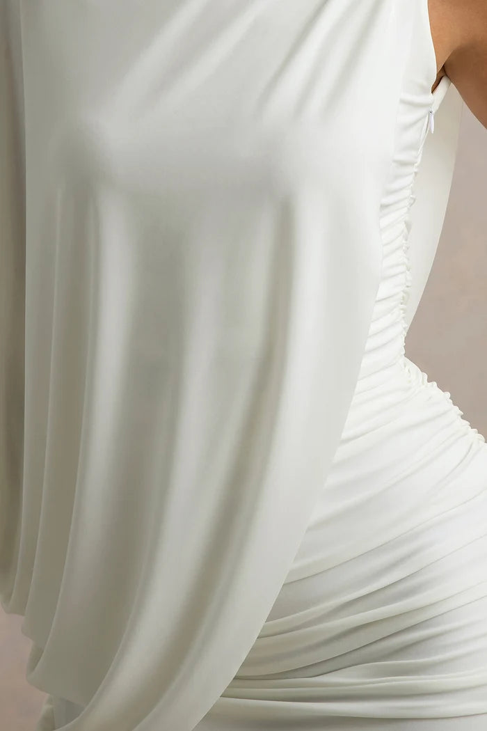 Woman wearing white ruched mini dress with draped overlay and white heels — Club L London | Endless UAE